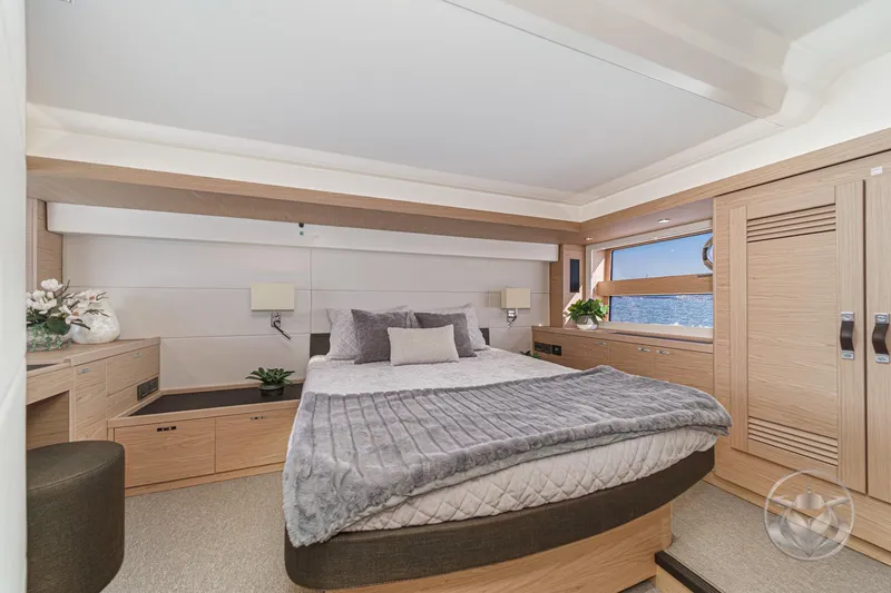 Slide: The Image of Luxurious bedroom interior of 2026 Beneteau Swift Trawler 54, featuring modern design and ocean view. - 26