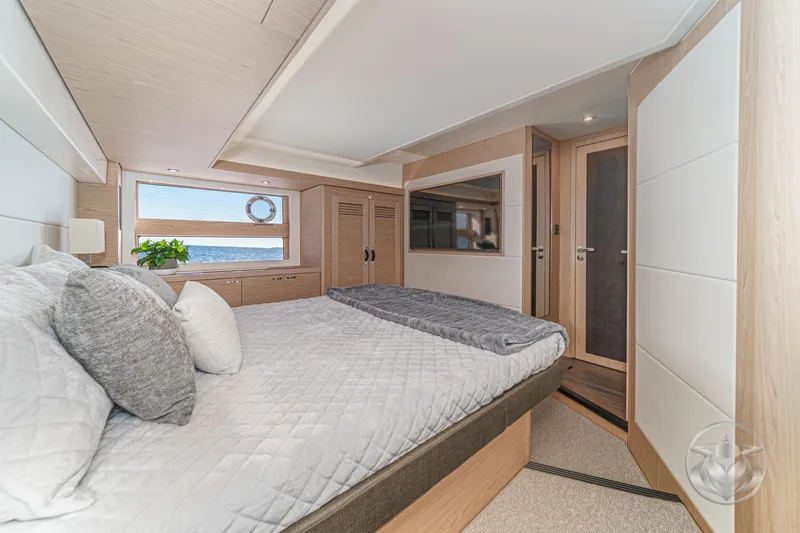 Slide: The Image of Luxurious bedroom interior of 2026 Beneteau Swift Trawler 54 with elegant decor. - 27