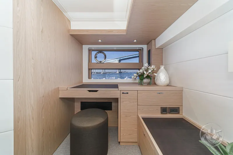 Slide: The Image of Luxurious bathroom in 2026 Beneteau Swift Trawler 54, featuring modern fixtures and elegant wood finishes. - 29