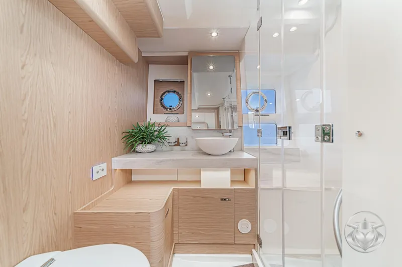 Slide: The Image of Luxurious bathroom in 2026 Beneteau Swift Trawler 54 yacht, featuring modern shower and sink. - 30
