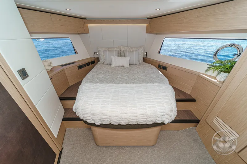 Slide: The Image of Luxurious bedroom interior of 2026 Beneteau Swift Trawler 54 with ocean view windows. - 32