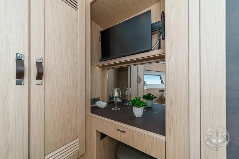 Slide: The Image of Luxurious interior of 2026 Beneteau Swift Trawler 54, featuring elegant bedroom and bathroom. - 35