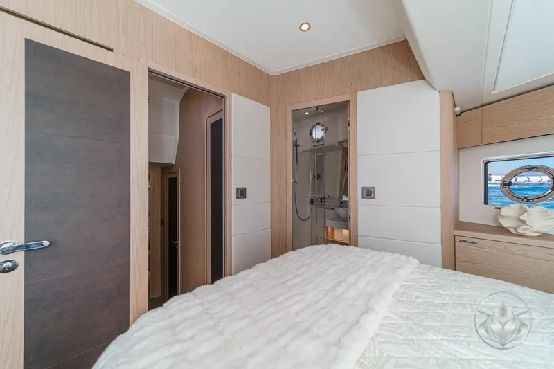 Slide: The Image of Modern bathroom in 2026 Beneteau Swift Trawler 54, featuring sleek shower and elegant sink. - 36