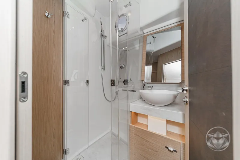 Slide: The Image of Luxurious bathroom in 2026 Beneteau Swift Trawler 54, featuring modern shower and elegant fixtures. - 37