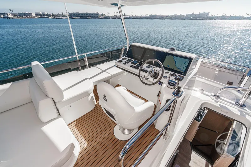 Slide: The Image of Engine room of 2026 Beneteau Swift Trawler 54, featuring dual engines and advanced control systems. - 46