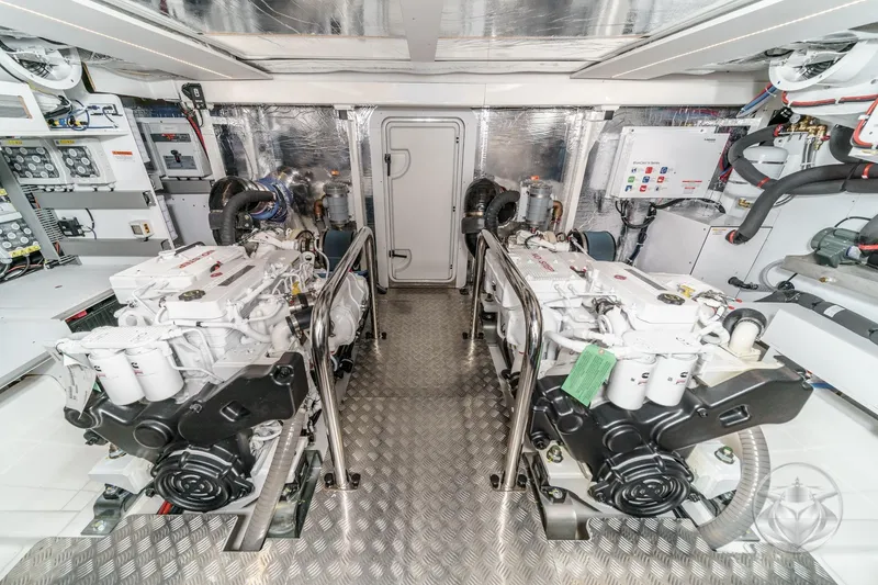 Slide: The Image of Engine room of 2026 Beneteau Swift Trawler 54, showcasing advanced machinery and controls. - 48