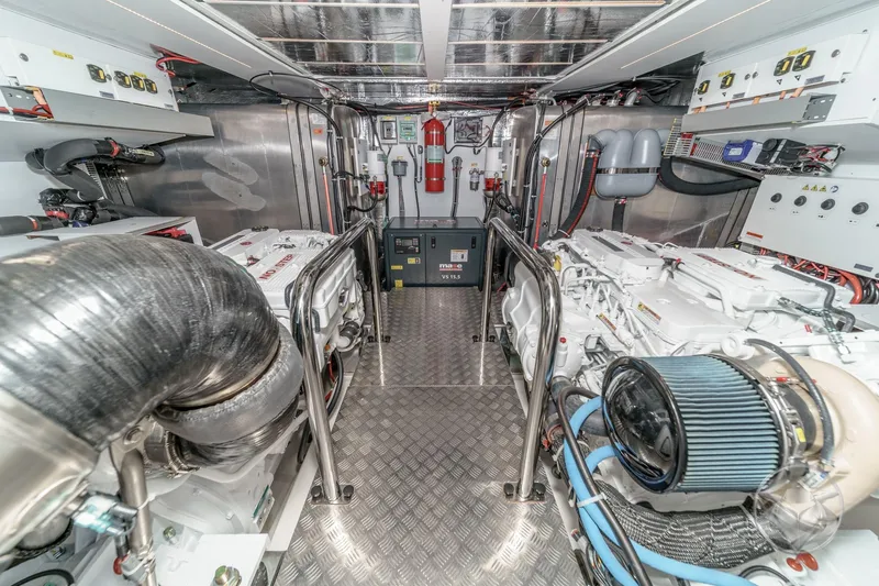 Slide: The Image of Engine room of 2026 Beneteau Swift Trawler 54 with visible machinery and equipment. - 49