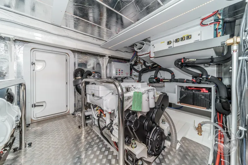 Slide: The Image of Mase generator in 2026 Beneteau Swift Trawler 54 engine room, featuring advanced controls. - 52