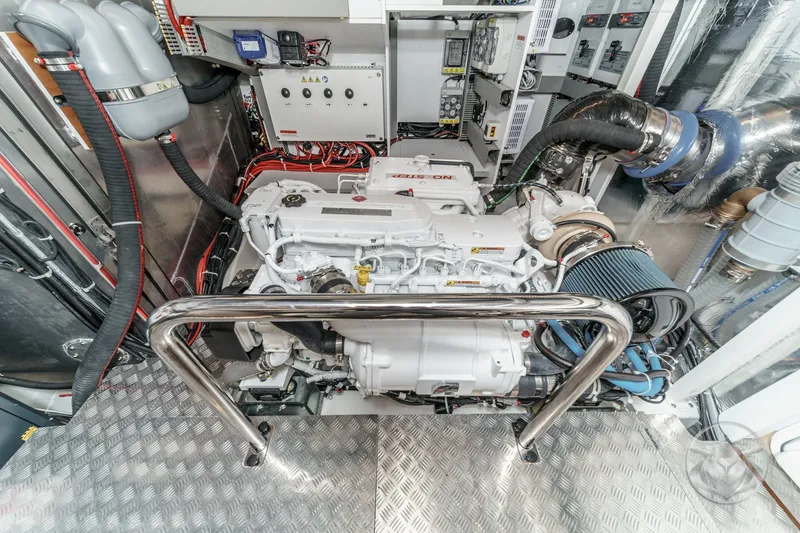 Slide: The Image of Open storage compartment on 2026 Beneteau Swift Trawler 54 with teak flooring. - 53