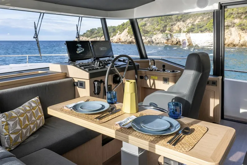 Slide: The Image of Beneteau Swift Trawler 54, 2026, for sale, deck view with ocean backdrop. - 7