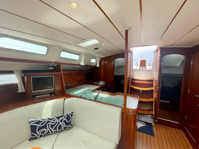Slide: The Image of Luxurious interior of 2004 Beneteau Oceanis Clipper 473 yacht with elegant wood finish. - 12