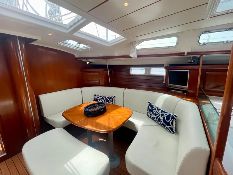 Slide: The Image of Luxurious interior of 2004 Beneteau Oceanis Clipper 473 yacht with elegant seating and wooden finishes. - 14