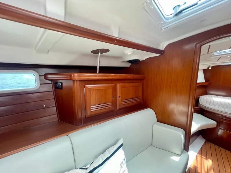 Slide: The Image of Interior of 2004 Beneteau Oceanis Clipper 473 yacht with wooden cabinetry and seating. - 17