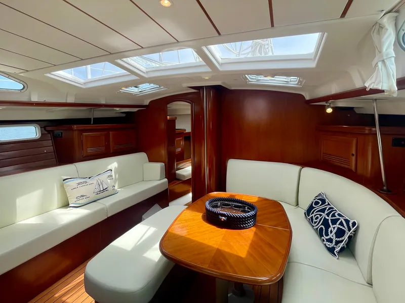 Slide: The Image of Interior of 2004 Beneteau Oceanis Clipper 473 yacht with elegant wood finish and skylights. - 18