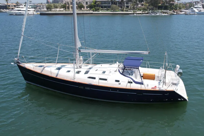 Slide: The Image of 2004 Beneteau Oceanis Clipper 473 sailboat on calm water, side view. - 3