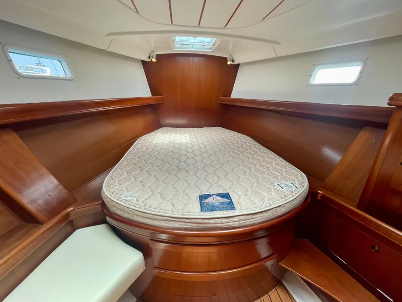 Slide: The Image of Luxurious cabin interior of 2004 Beneteau Oceanis Clipper 473 sailboat with wooden finish. - 37