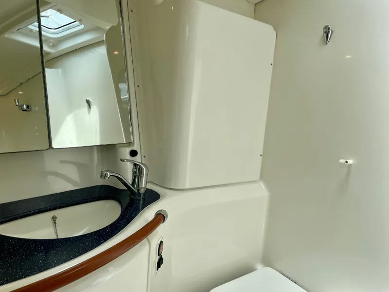Slide: The Image of Bathroom interior of 2004 Beneteau Oceanis Clipper 473 yacht, featuring sink and mirror. - 42