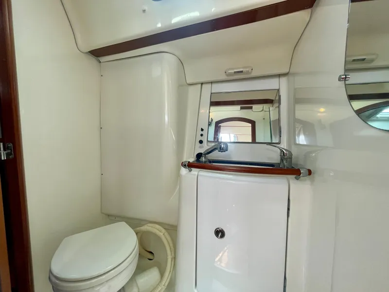 Slide: The Image of Bathroom interior of 2004 Beneteau Oceanis Clipper 473 yacht, featuring toilet and sink. - 46