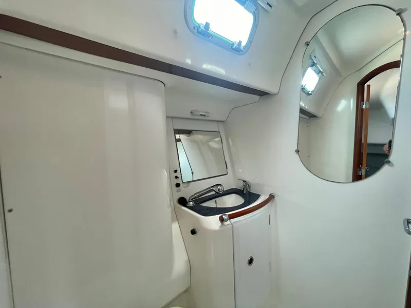 Slide: The Image of Interior of 2004 Beneteau Oceanis Clipper 473 yacht bathroom with sink and mirror. - 47