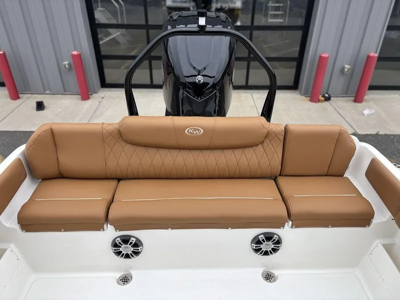 Slide: The Image of 2025 Key West 239FSR boat with tan leather seating and modern design. - 12