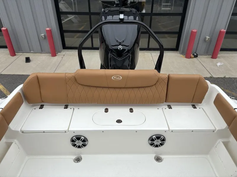 Slide: The Image of 2025 Key West 239FSR boat interior with tan seating and modern design. - 13