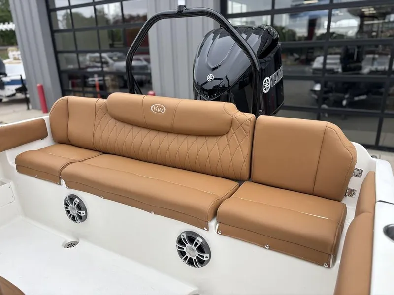 Slide: The Image of Luxurious tan seating on 2025 Key West 239FSR boat, featuring Yamaha engine and built-in speakers. - 14