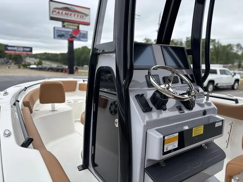 Slide: The Image of 2025 Key West 239FSR boat interior with modern console and seating. - 15