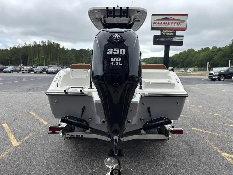 Slide: The Image of 2025 Key West 239FSR boat with 350 V6 engine, parked outdoors near dealership. - 18