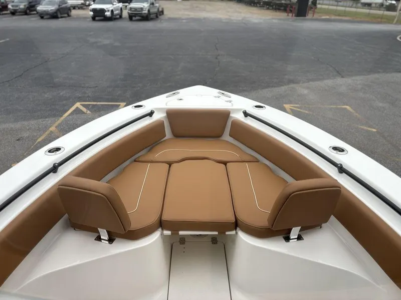 Slide: The Image of 2025 Key West 239FSR boat with tan seating in the bow area. - 24