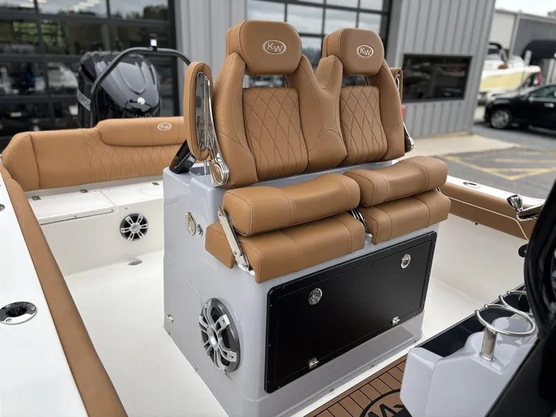 Slide: The Image of 2025 Key West 239FSR boat with tan leather seats and modern design. - 5