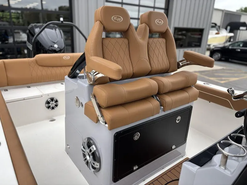 Slide: The Image of 2025 Key West 239FSR boat with luxurious tan seating and modern design. - 7