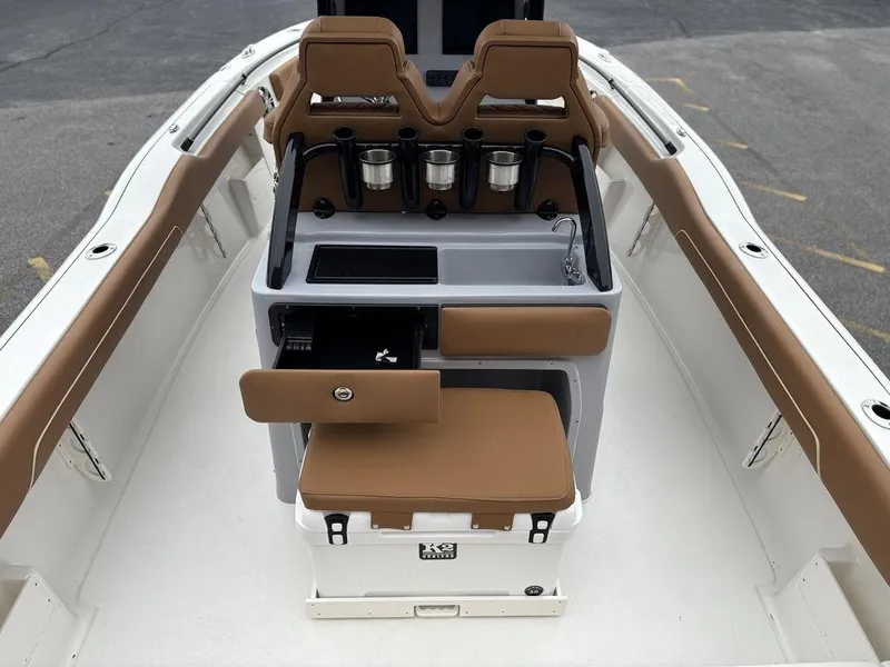 Slide: The Image of 2025 Key West 239FSR boat interior with seating and storage compartments. - 9