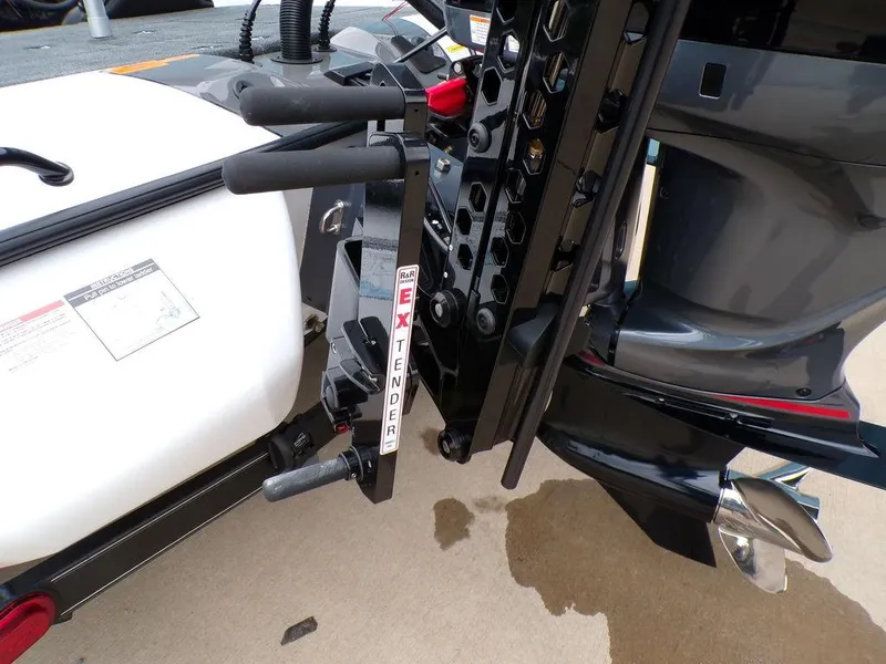 Slide: The Image of 2025 Skeeter ZXR20 boat motor with extender attachment on a concrete surface. - 17