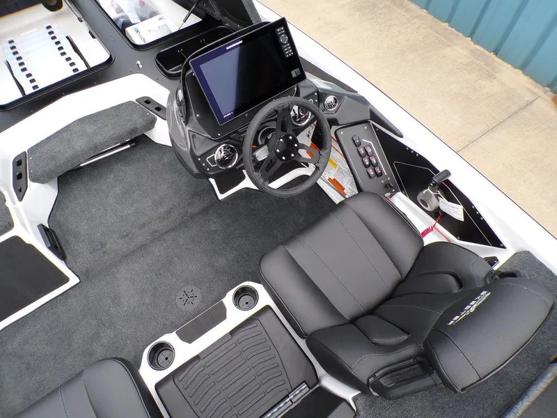 Slide: The Image of 2025 Skeeter ZXR20 boat interior with modern dashboard and seating. - 2