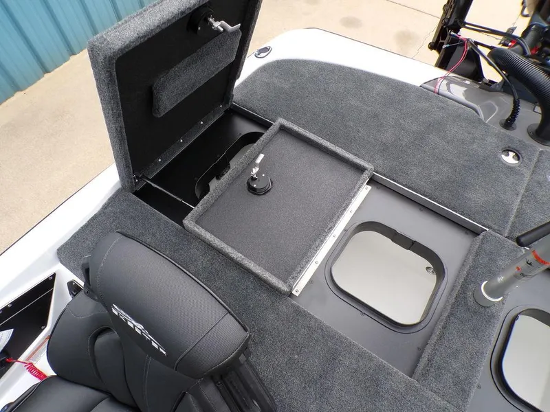 Slide: The Image of 2025 Skeeter ZXR20 boat interior with open storage compartments and seating. - 3