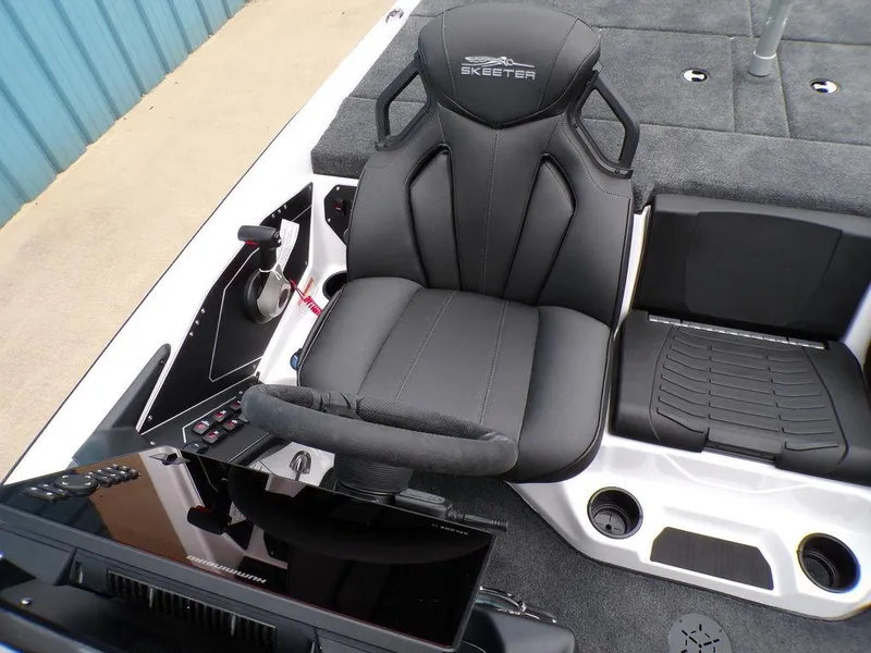 Slide: The Image of 2025 Skeeter ZXR20 boat cockpit with black captain's chair and control panel. - 6