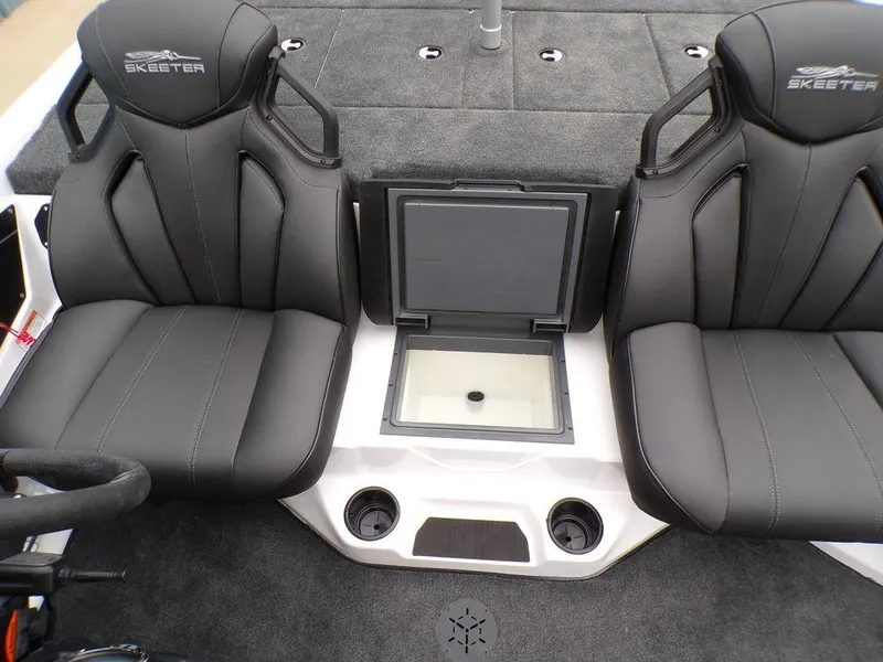 Slide: The Image of Skeeter ZXR20 2025 boat interior with two black seats and storage compartment. - 7