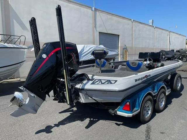 Slide: The Image of 2018 Ranger Z521L boat with powerful outboard motor, parked outdoors. - 3