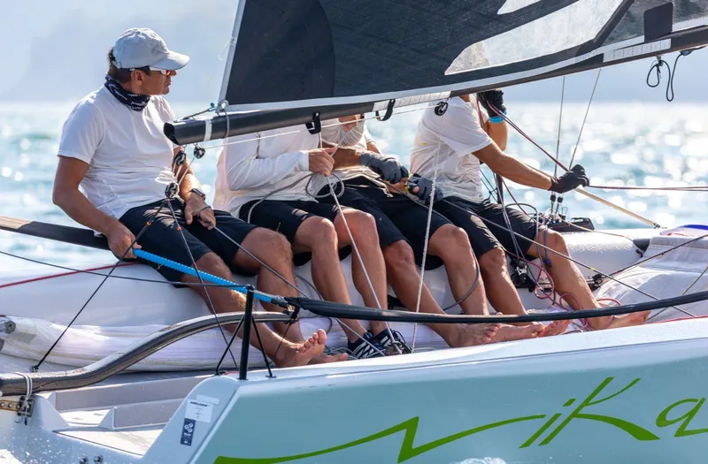 Slide: The Image of Sailors racing on a 2016 Melges 20 sailboat in sunny weather. - 10