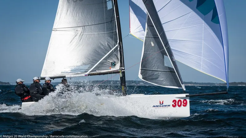 Slide: The Image of Sailing team racing a 2016 Melges 20 boat, cutting through waves with full sails. - 8