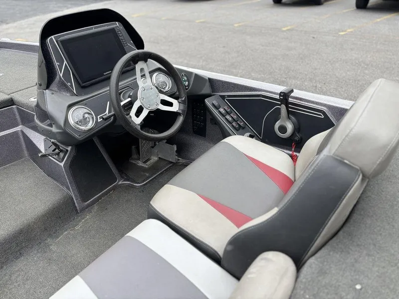 Slide: The Image of 2017 Skeeter ZX250 boat cockpit with steering wheel and control panel. - 10