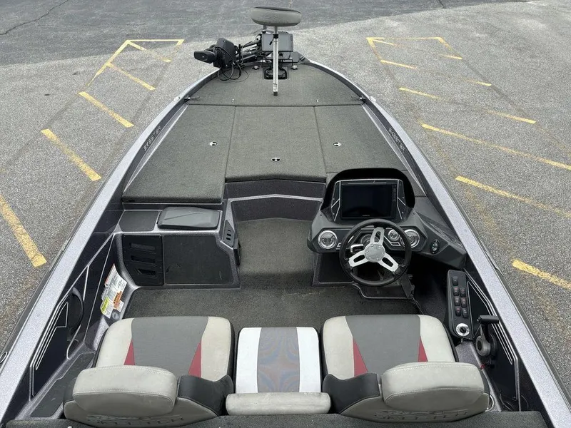 Slide: The Image of 2017 Skeeter ZX250 boat interior with steering wheel, seats, and control panel. - 14