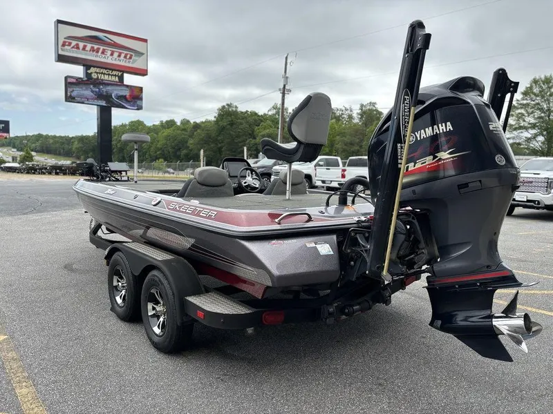 Slide: The Image of 2017 Skeeter ZX250 boat with Yamaha engine in parking lot. - 4