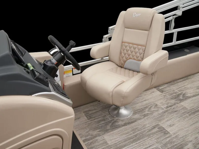 Slide: The Image of 2024 Ranger 220FC boat interior with beige captain's chair and steering console. - 10
