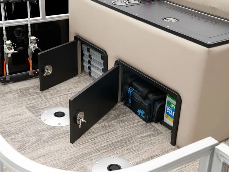 Slide: The Image of 2024 Ranger 220FC boat storage compartments with fishing gear and accessories. - 11
