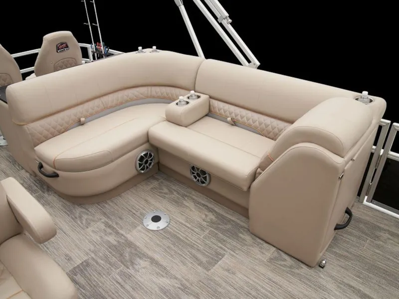 Slide: The Image of 2024 Ranger 220FC boat interior with beige seating and cup holders. - 13