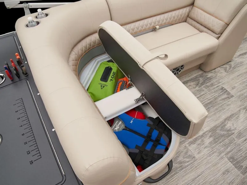 Slide: The Image of 2024 Ranger 220FC boat interior with open storage compartment, revealing life jackets and gear. - 15