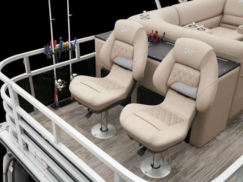 Slide: The Image of 2024 Ranger 220FC boat interior with beige cushioned seats and fishing rod holders. - 16