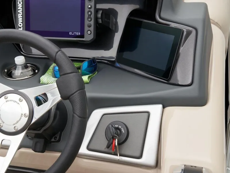 Slide: The Image of 2024 Ranger 220FC dashboard with steering wheel, digital displays, and ignition keys. - 6