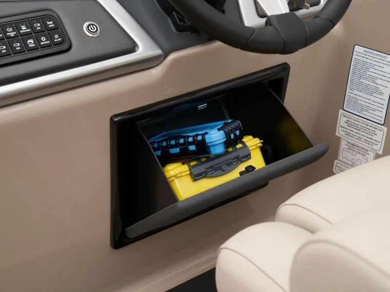 Slide: The Image of Storage compartment in 2024 Ranger 220FC boat dashboard with electronic devices. - 9